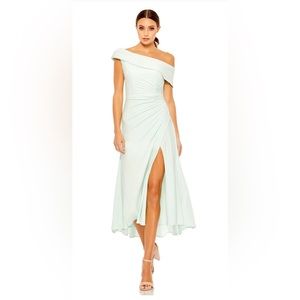 Off shoulder midi light torquois dress with slit in the front.